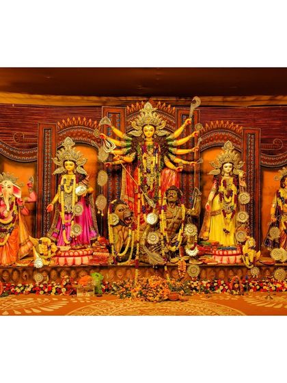 A beautifully decorated Durga Puja pandal in Delhi, showcasing the complete tableau of the goddess and her children.