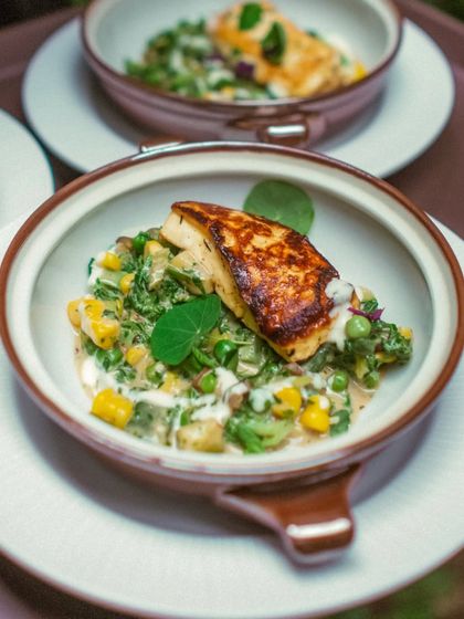 A celebration of winter produce. This dish combines pan-roasted halloumi from Begum Victoria Cheese with a green vegetable étouffée and a delicate saffron nage.