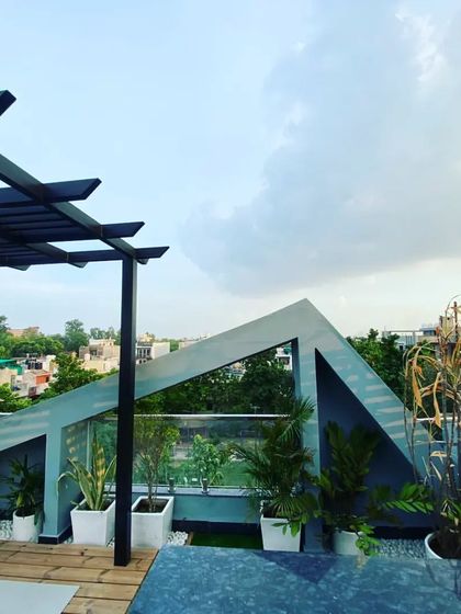 Another view of the Vikaspuri project, showing the unique architectural elements of the building integrated with our pergola and planter design.