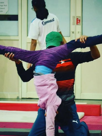 This image shows the incredible flexibility our gymnasts can achieve with dedicated training and expert guidance.