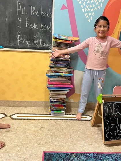 This is what a love for reading looks like. We are so proud of our library members and the incredible stacks of books they read, showing just how much they've grown into avid readers.