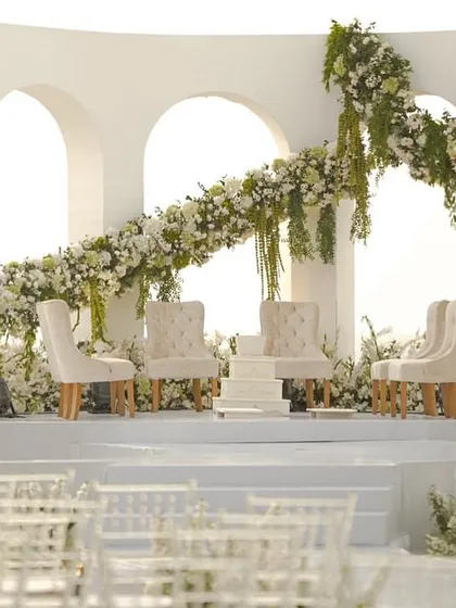 A wide shot of the modern, all-white mandap I designed at the Taj Holiday Village, Goa. The clean lines and ocean view create a picture of serene, contemporary elegance.