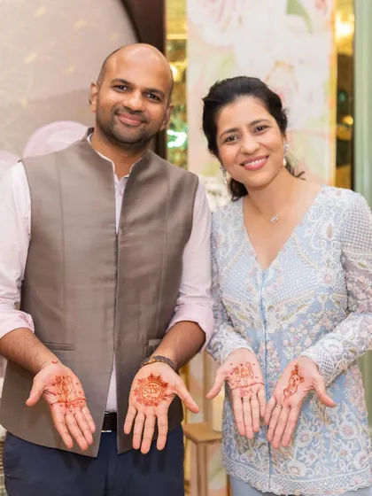 Showing off our matching henna. It's these small, fun moments during wedding festivities that bring everyone together.