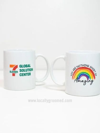 We can print any design on our ceramic mugs. This image shows a mug for the Global Solution Center and another with a cheerful rainbow design, showcasing our versatility.