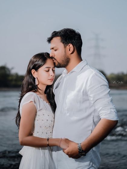 A slightly different angle of the tender forehead kiss, this photo feels soft, peaceful, and full of affection.