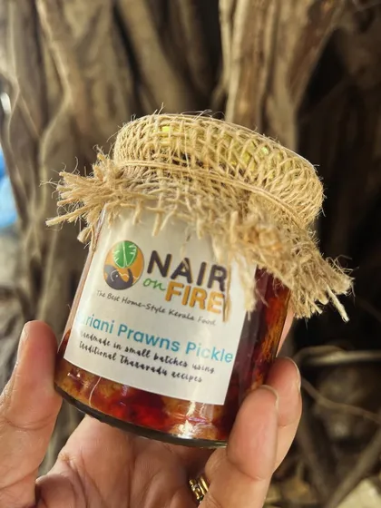 I'm holding a jar of my Suriani Prawns Pickle, a recipe that carries stories of summer holidays and Sunday feasts. Each jar is packed with plump prawns and a fiery, flavourful masala. This is more than a condiment; it's a rescue squad for a dull meal, handmade with care.