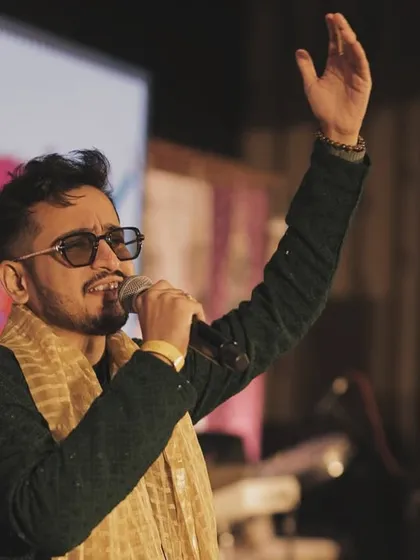 A close-up shot from the Surat event, lost in the melody. I sing every song from the heart, aiming to connect with the audience on an emotional level through the music.