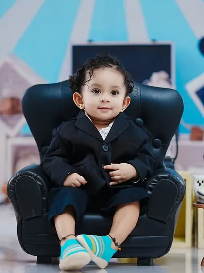 A classic Boss Baby pose. This toddler looks ready to take over the boardroom in his little suit.