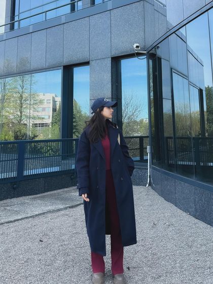 A full-length shot of my Trendyol coord set outfit outside a modern campus building.