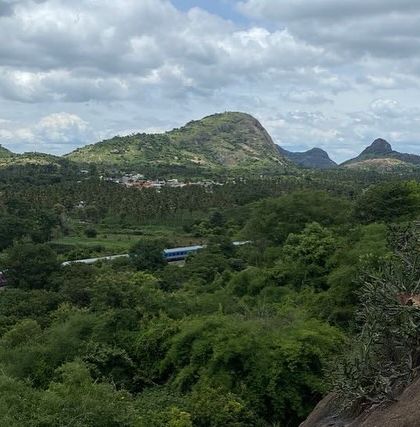 A climber watches a train pass by from the Gethnaa crag. These are the small, memorable moments that make outdoor climbing special.