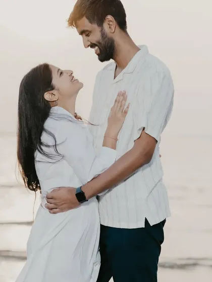 The look of love. This photo captures the happy, smiling connection between the couple during their beach photoshoot.