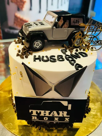 A personalized Thar cake for a husband, combining his love for the vehicle with a special birthday message.