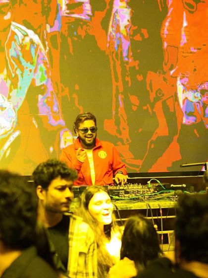 Let the music take you to places you've never been. A shot of me interacting with the crowd from the DJ booth.