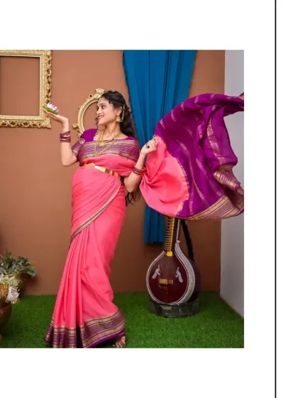 A dynamic shot where the flowing pallu of the saree adds a sense of life and movement. This pose is both playful and elegant, perfectly capturing the joy of the mother-to-be in our traditional Indian setting.