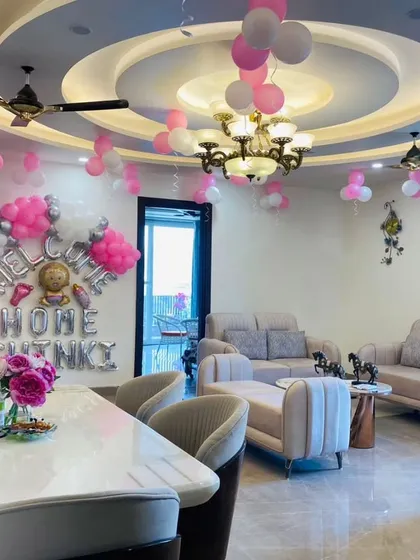 This wide shot shows how my decorations can transform an entire living space for a welcome home party, creating a cohesive and celebratory environment for the whole family.
