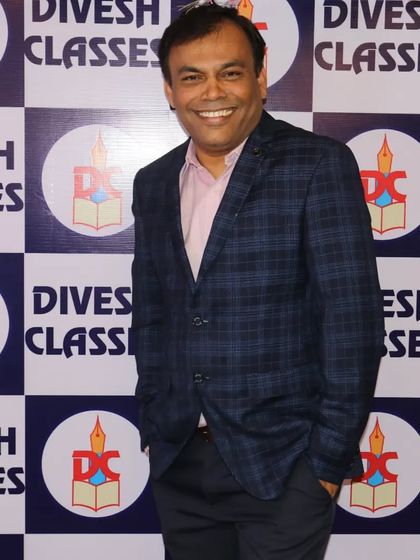 A classic portrait of Prof. Dashrath Parab, the founder and director of Divesh Classes.