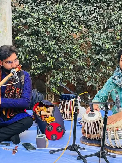 Performing a jugalbandi in a serene garden setting for a private event.