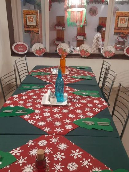 Our tables are set for a magical Christmas experience. The festive runners and decor create a warm, inviting atmosphere for your holiday gatherings.