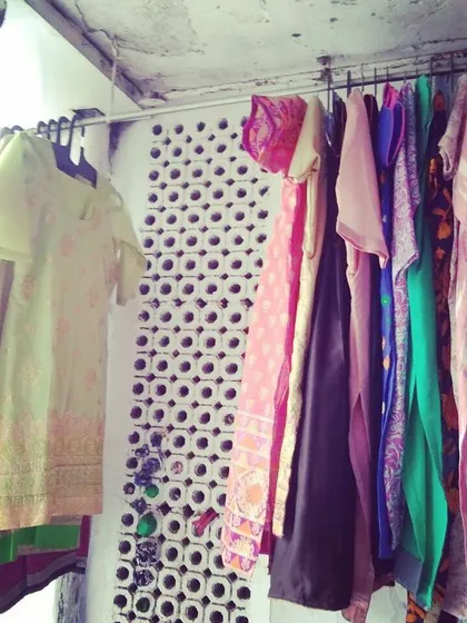A rack of freshly stitched kurtis and suits ready for delivery. Every piece is carefully crafted to meet our client's specific requirements.