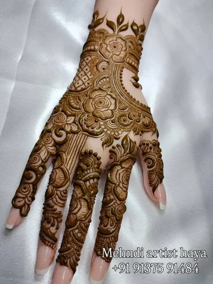 A final view of this intricate floral and geometric hand design.