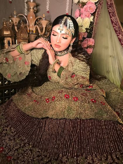 A serene and graceful portrait. The makeup is soft and luminous, with closed eyes to show the subtle yet beautiful eyeshadow work.