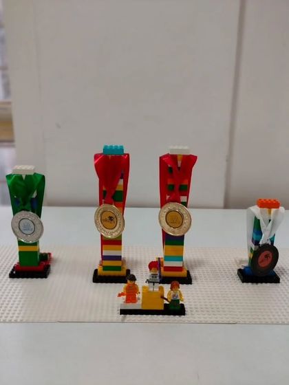 We believe in celebrating every achievement. Our students even build their own LEGO trophies for our internal competitions, adding another layer of fun and creativity.