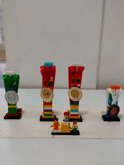 We believe in celebrating every achievement. Our students even build their own LEGO trophies for our internal competitions, adding another layer of fun and creativity.