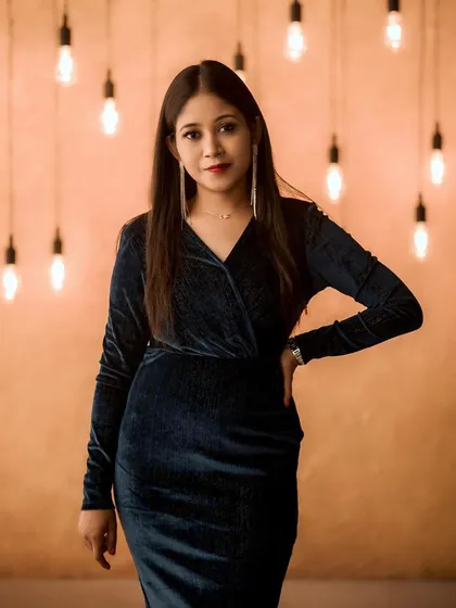 A classic smokey eye and a subtle red lip create a timeless cocktail look. This is perfect for evening party makeup or a glamorous portfolio shoot, designed to look stunning under any lighting.