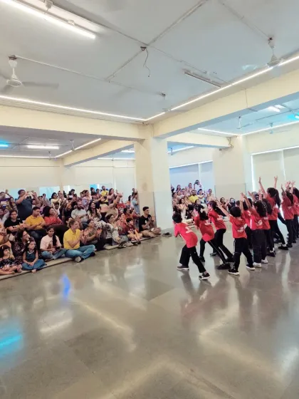 Our youngest performers in their red 'Super Club' shirts, performing for a packed house of proud parents during our studio presentation. It's a celebration of their progress.