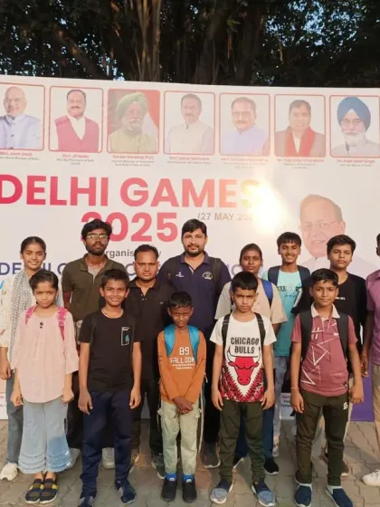 Team ASHA posing in front of the Delhi Games 2025 banner. We are proud to represent our academy at such a prestigious event.