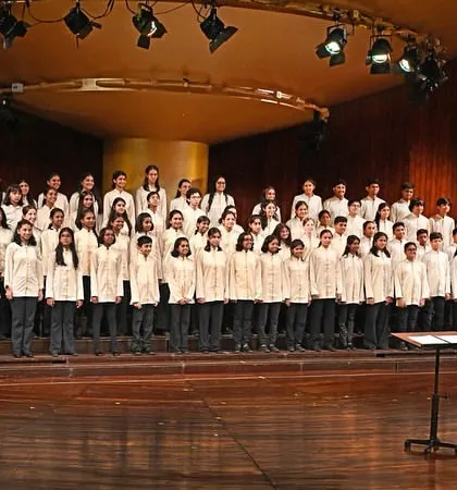 Our full Singing Tree Choir on stage at the NCPA, conducted with precision and passion. This image captures the scale and professionalism of our annual choral concerts.