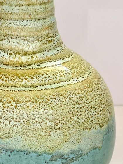 A close-up of the textured glaze on the "Coral Coast" vase. The tiny bubbles and color variations make it feel alive and organic.