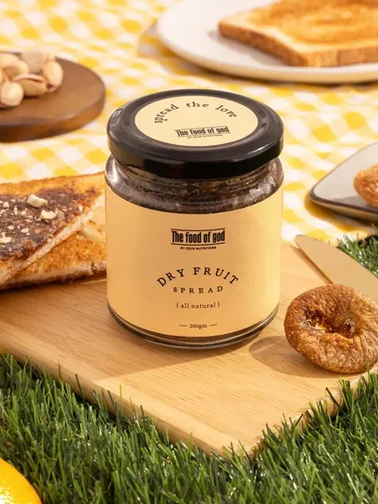 A picnic themed shot for a dry fruit spread. We used a yellow checkered cloth on artificial grass and styled the product with toast and fresh ingredients to create a wholesome, outdoorsy vibe.