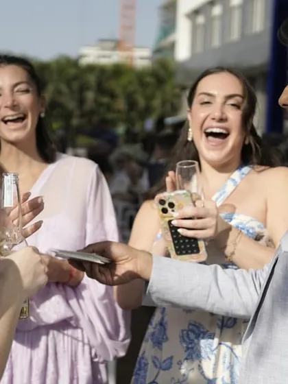 Entertainment is about connection and joy. Here, I'm performing close-up magic at a wedding celebration, sharing a moment of laughter and amazement. This is perfect for breaking the ice and making any event feel more personal and engaging.