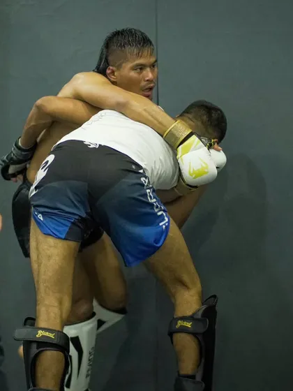 A fighter uses the cage wall to his advantage, clinching with his opponent. We teach wrestling specifically for MMA, including how to use the environment in a fight.