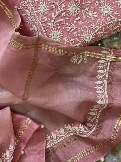 A macro detail of the dupatta border, highlighting the gota work and seed pearls.