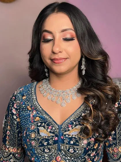 A detailed shot of the eye makeup, featuring a blend of soft pinks and a touch of shimmer.