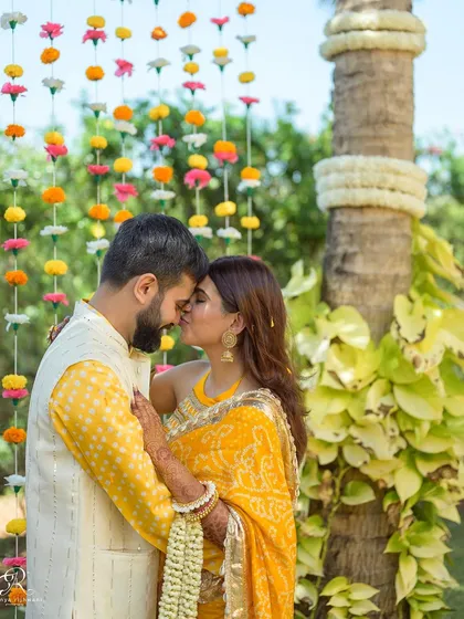 A tender kiss on the forehead. These quiet, intimate moments amidst the chaos of a wedding celebration are often the most precious to look back on.