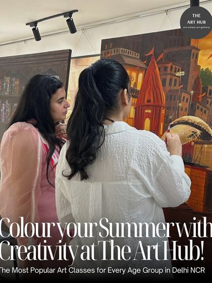 An instructor provides guidance to a student working on a large canvas painting of a cityscape. I ensure every student gets the attention they need to succeed.