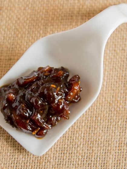 A spoonful of my Dates pickle. It's sweet, tangy, and completely seedless, making it a unique and delicious treat.