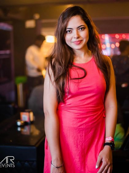 A guest posing at the bar.