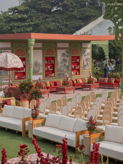The guest seating area, featuring a mix of modern white sofas and traditional chairs, offering a comfortable and stylish viewing experience for the ceremony.