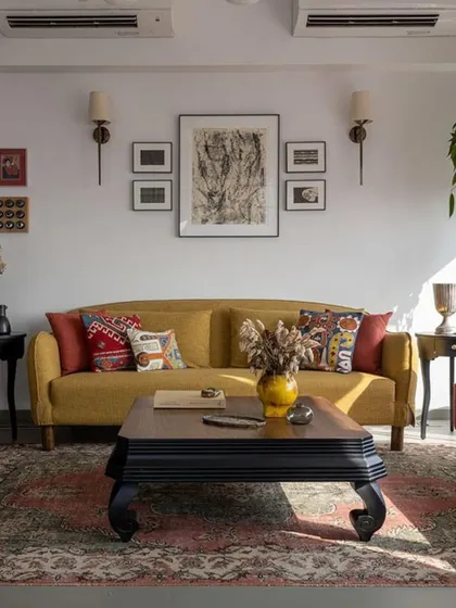 A mustard yellow sofa brings a pop of color to this calm, textural living room. The space, part of the 'Inde Blue' project, was designed to feel like a deep exhale, with a focus on handmade imperfections and soulful, personal touches.