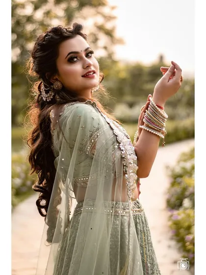 A portrait is a story, and this one is full of joy and grace. We were shooting outdoors, and her smile lit up the entire frame. It shows how a beautiful traditional lehenga can shine in natural light.