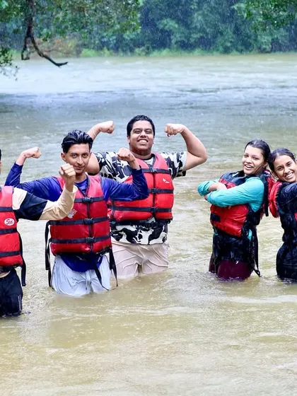 Flexing their new muscles and confidence. A group of participants strikes a pose after a fun and challenging day on the river.