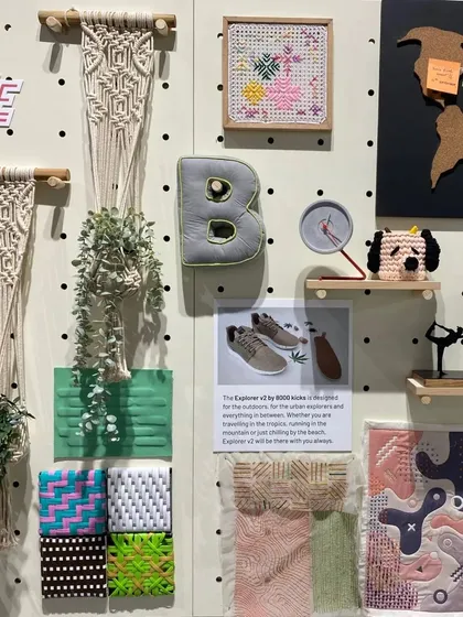 A mood board from our 'Solo Commerce' installation. The display explores the lifestyle of gig-entrepreneurs through a collection of handcrafted objects, plants, and personal items.