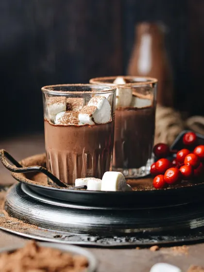 Another take on hot chocolate and marshmallows, this time with a darker, moodier feel. The contrast with the bright red cranberries adds a festive pop of color.