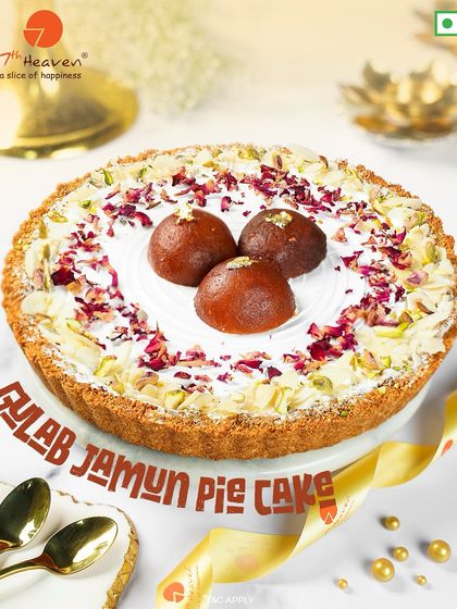 A customer favorite, our Gulab Jamun Pie Cake. This dessert features a crumbly pie crust, a creamy filling, and is topped with soft gulab jamuns, rose petals, and pistachios.