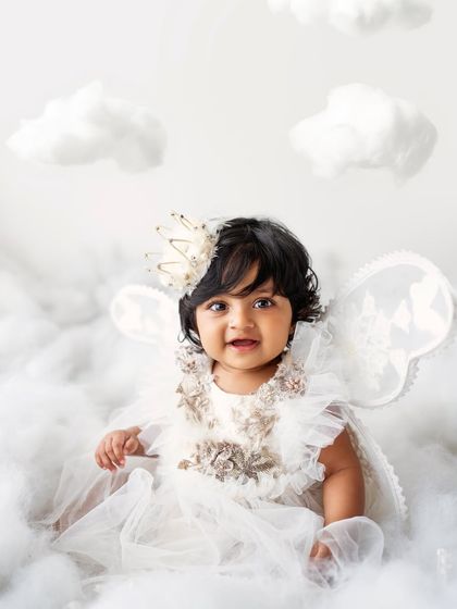 A sweet, curious expression from our little angel. These sessions are perfect for capturing the innocence of babyhood.