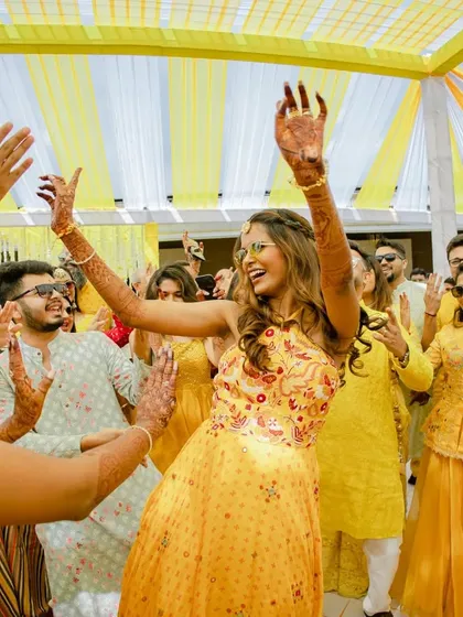 The bride leading the dance party at her Haldi. Her energy and happiness are infectious.